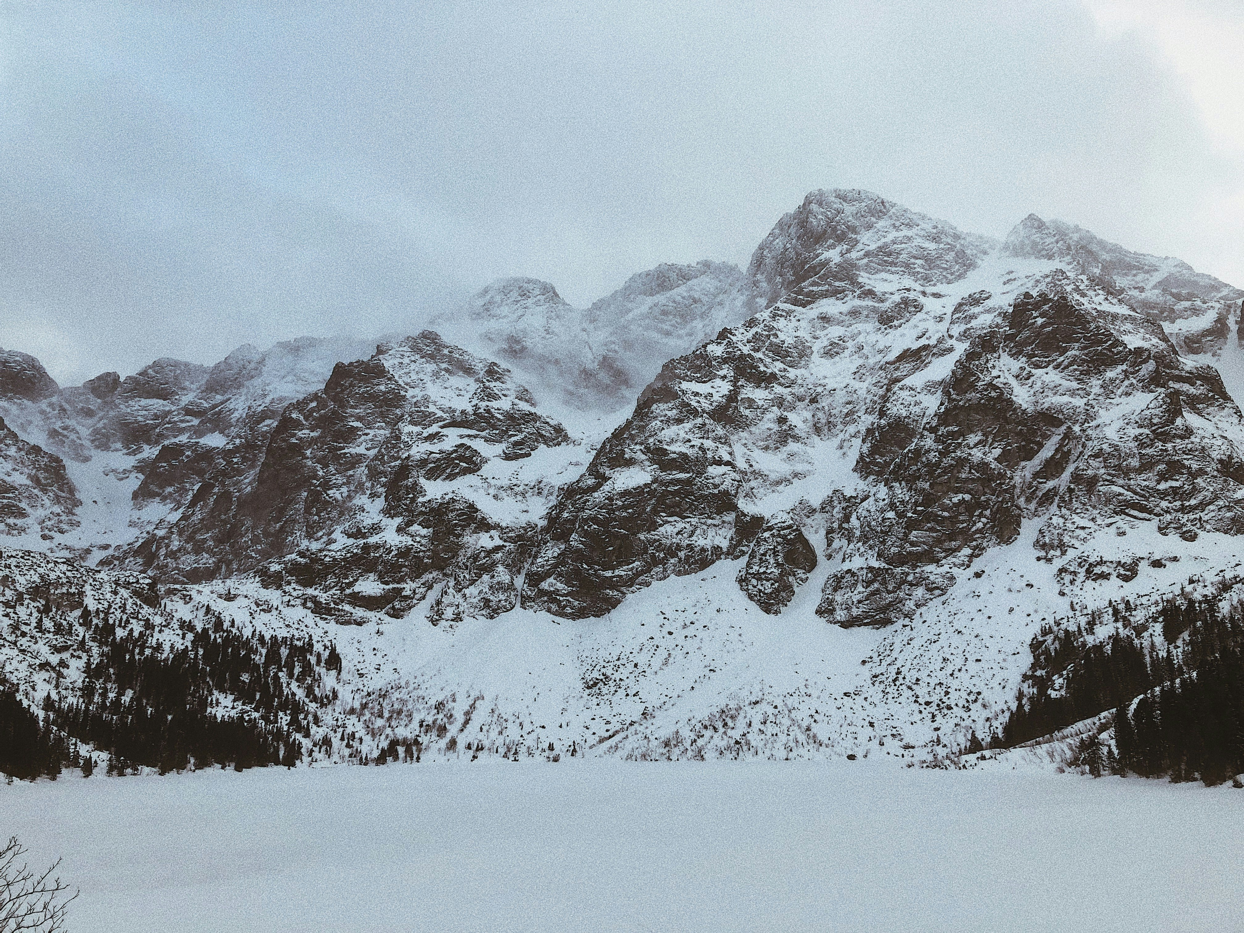 snow covered mountain during daytime